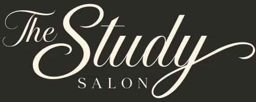 Cream script salon wordmark centered on black