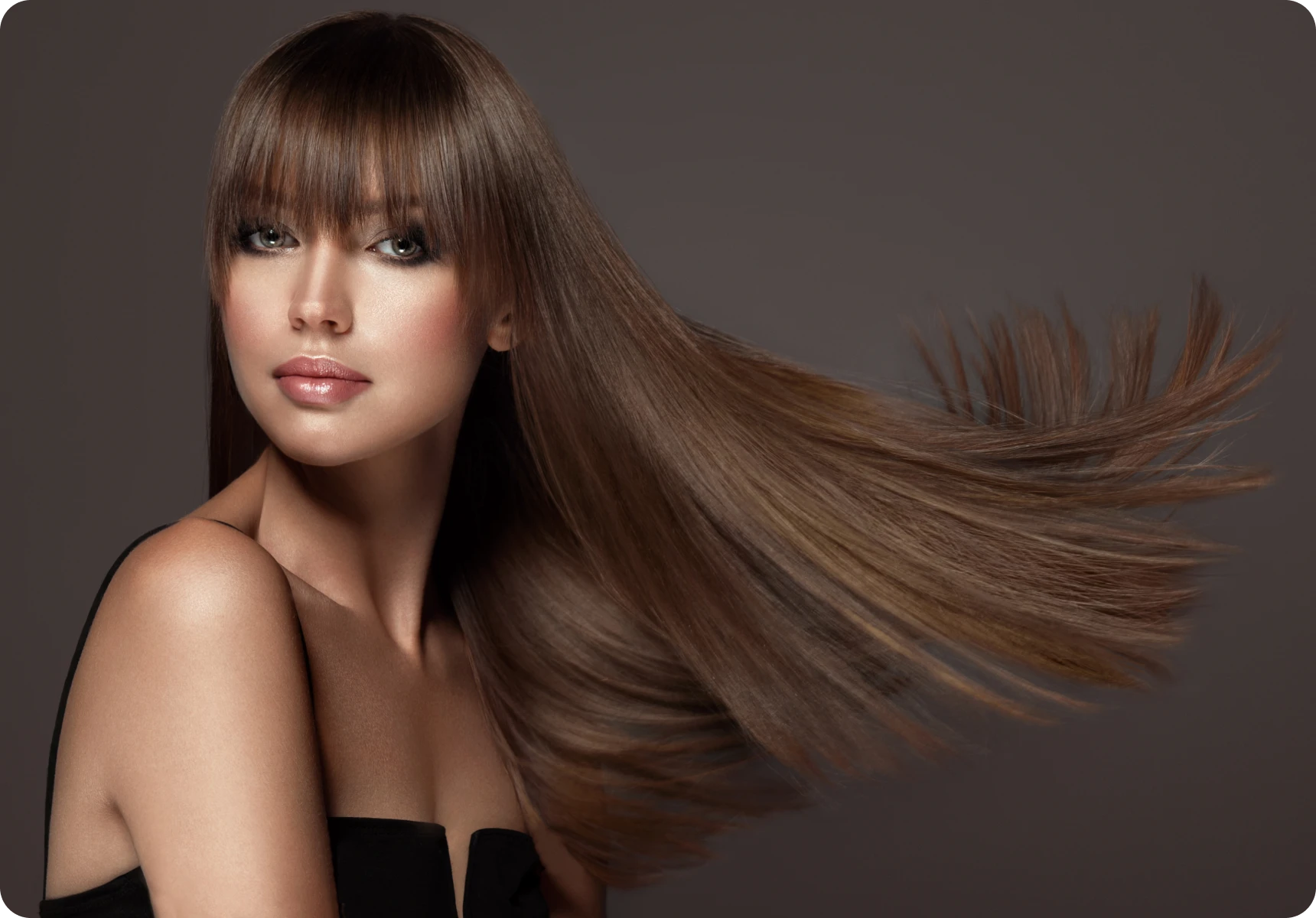 Model showcasing shiny, straight hairstyle